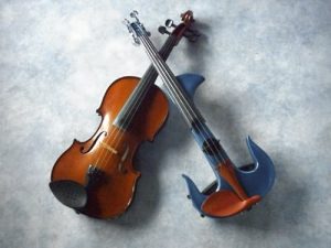 A traditional acoustic violin and a modern electronic violin from Marc Capuano